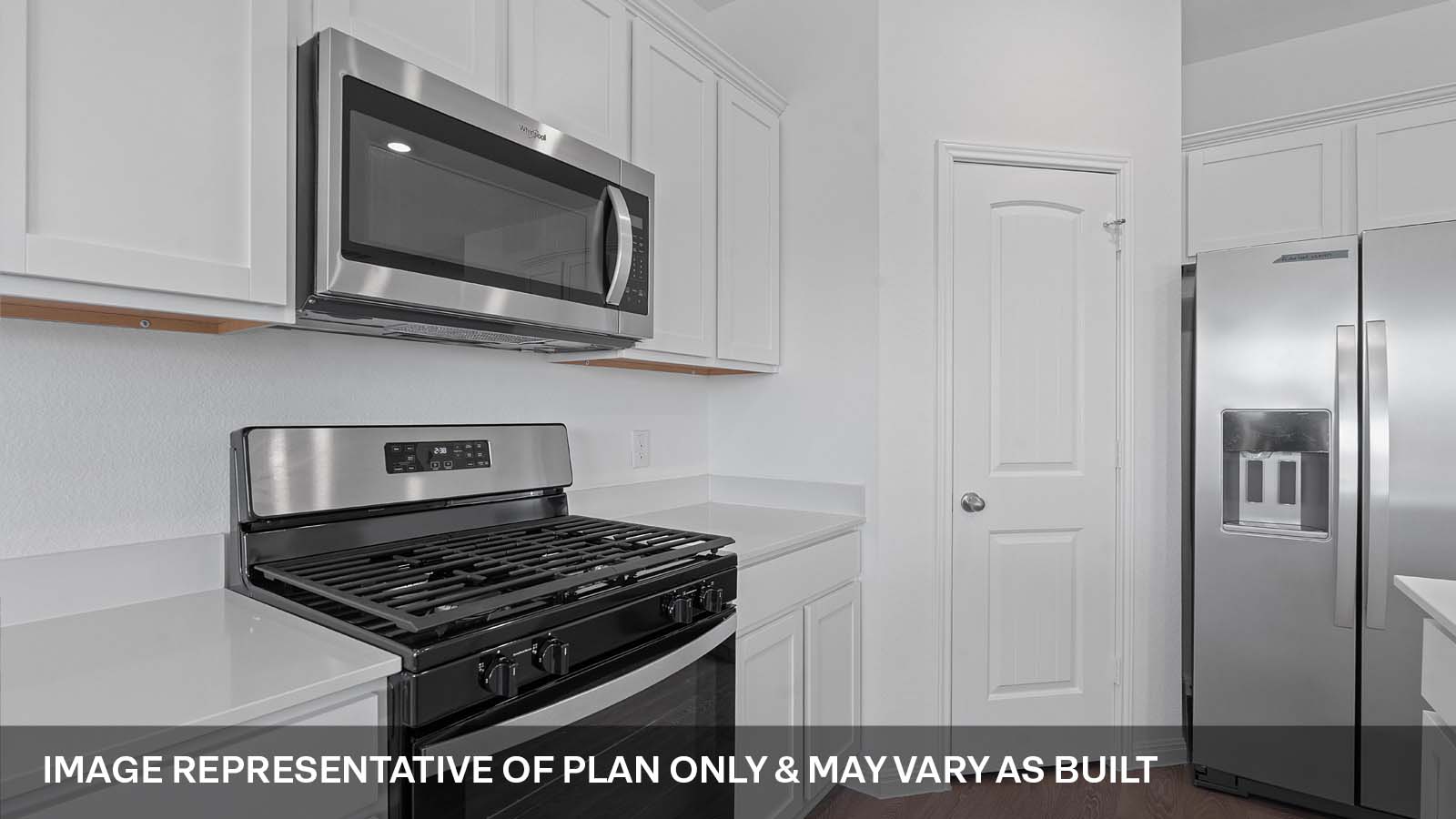 424 Mountain Pea Road Kyle, TX 78640 - Photo 10 of 25 a kitchen with stainless steel appliances granite countertop a stove and a microwave