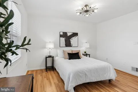 a view of a kitchen with stove and cabinets