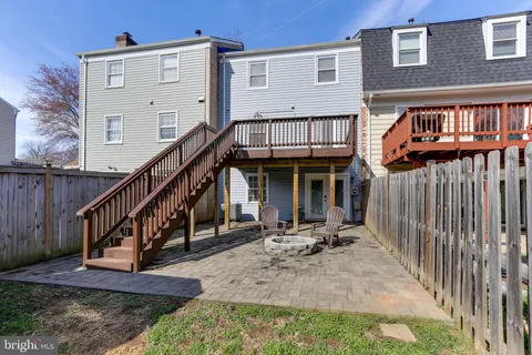 a view of a porch with furniture and a yard