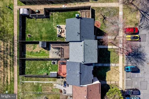an aerial view of houses with outdoor space