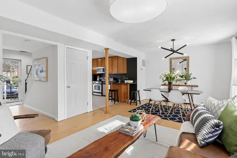 an aerial view of a house with a yard basket ball court and outdoor seating