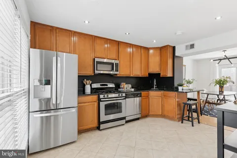 a view of balcony with wooden floor and fence