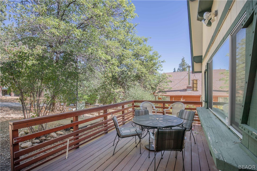 753 Maple Lane Sugarloaf, CA 92386 - Photo 11 of 42 a view of balcony with wooden floor and outdoor seating