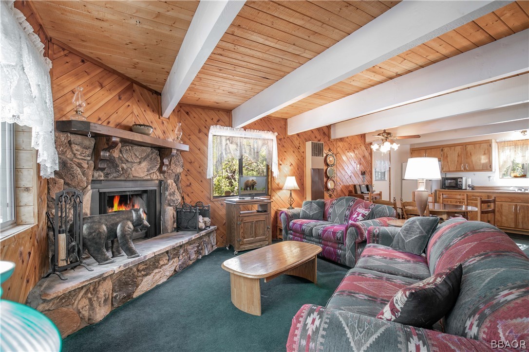 753 Maple Lane Sugarloaf, CA 92386 - Photo 12 of 42 a living room with furniture fireplace and a large window