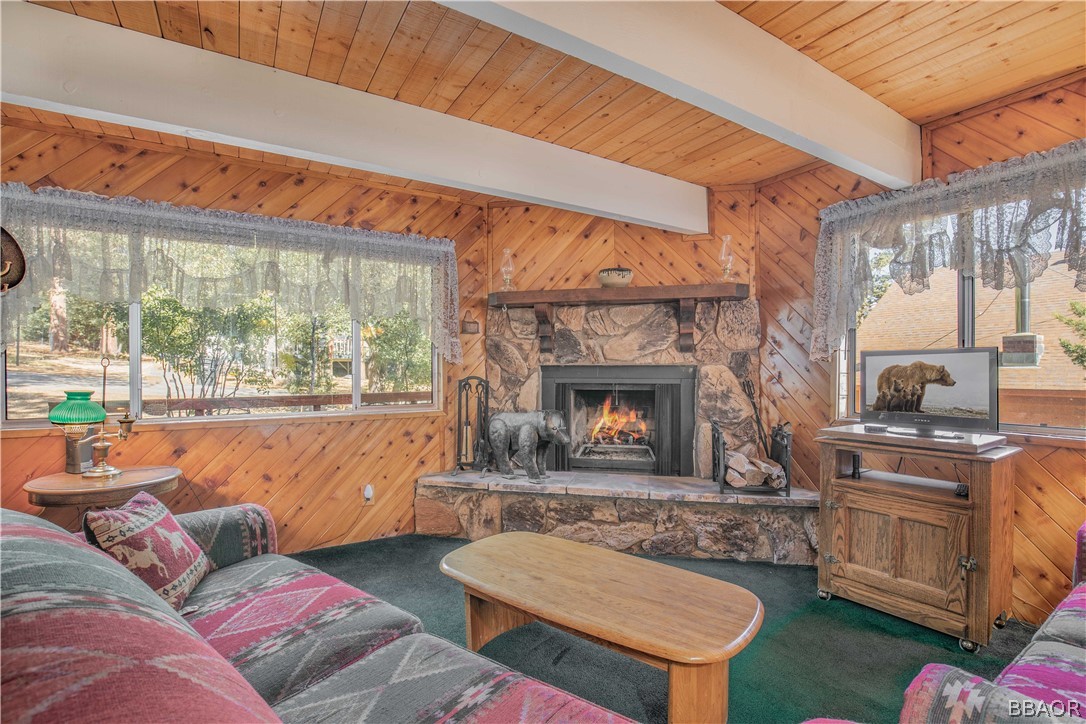 753 Maple Lane Sugarloaf, CA 92386 - Photo 13 of 42 a living room with furniture a fireplace and a table