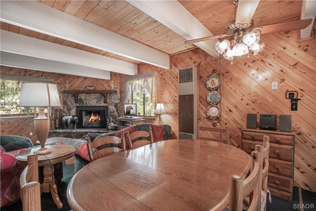 753 Maple Lane Sugarloaf, CA 92386 - Photo 19 of 42 a living room with fireplace a flat screen tv and a fireplace
