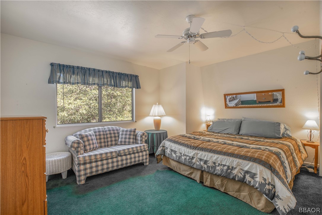 753 Maple Lane Sugarloaf, CA 92386 - Photo 21 of 42 a bedroom with bed and a window