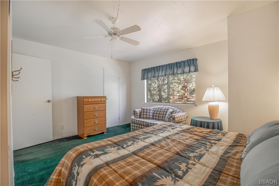 753 Maple Lane Sugarloaf, CA 92386 - Photo 23 of 42 a bedroom with a bed and a window