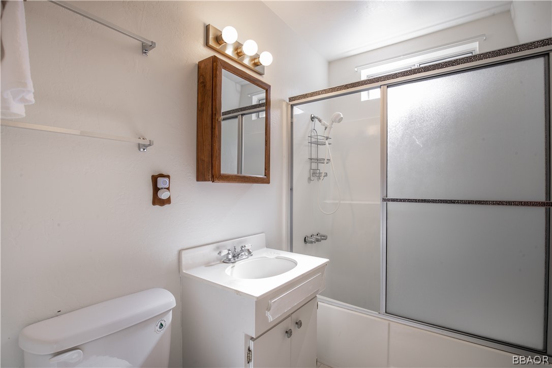 753 Maple Lane Sugarloaf, CA 92386 - Photo 25 of 42 a bathroom with a sink toilet and shower