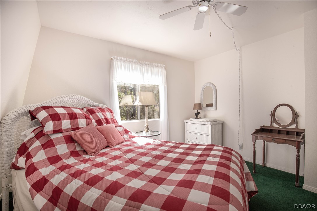 753 Maple Lane Sugarloaf, CA 92386 - Photo 28 of 42 a bedroom with a bed and a window
