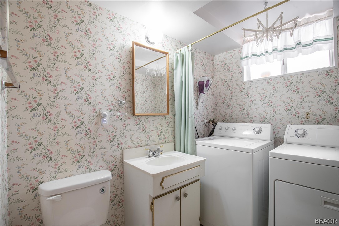 753 Maple Lane Sugarloaf, CA 92386 - Photo 30 of 42 a bathroom with a sink a toilet and a mirror