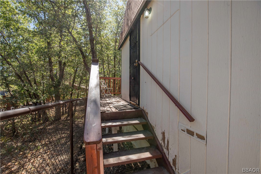 753 Maple Lane Sugarloaf, CA 92386 - Photo 33 of 42 a view of a balcony with wooden floor and stairs