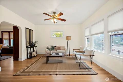 a view of a livingroom with furniture and hardwood floor
