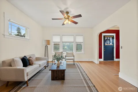 a living room with furniture and a large window
