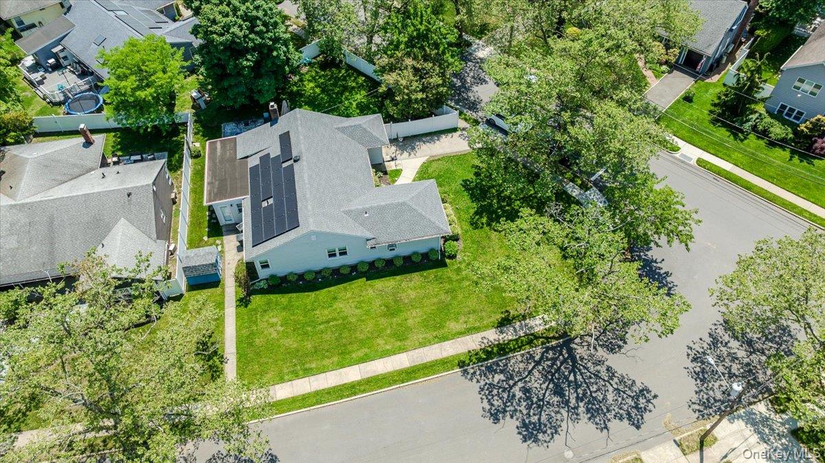 534 Allen Road Woodmere, NY 11598 - Photo 30 of 35 an aerial view of a house with a yard and large trees