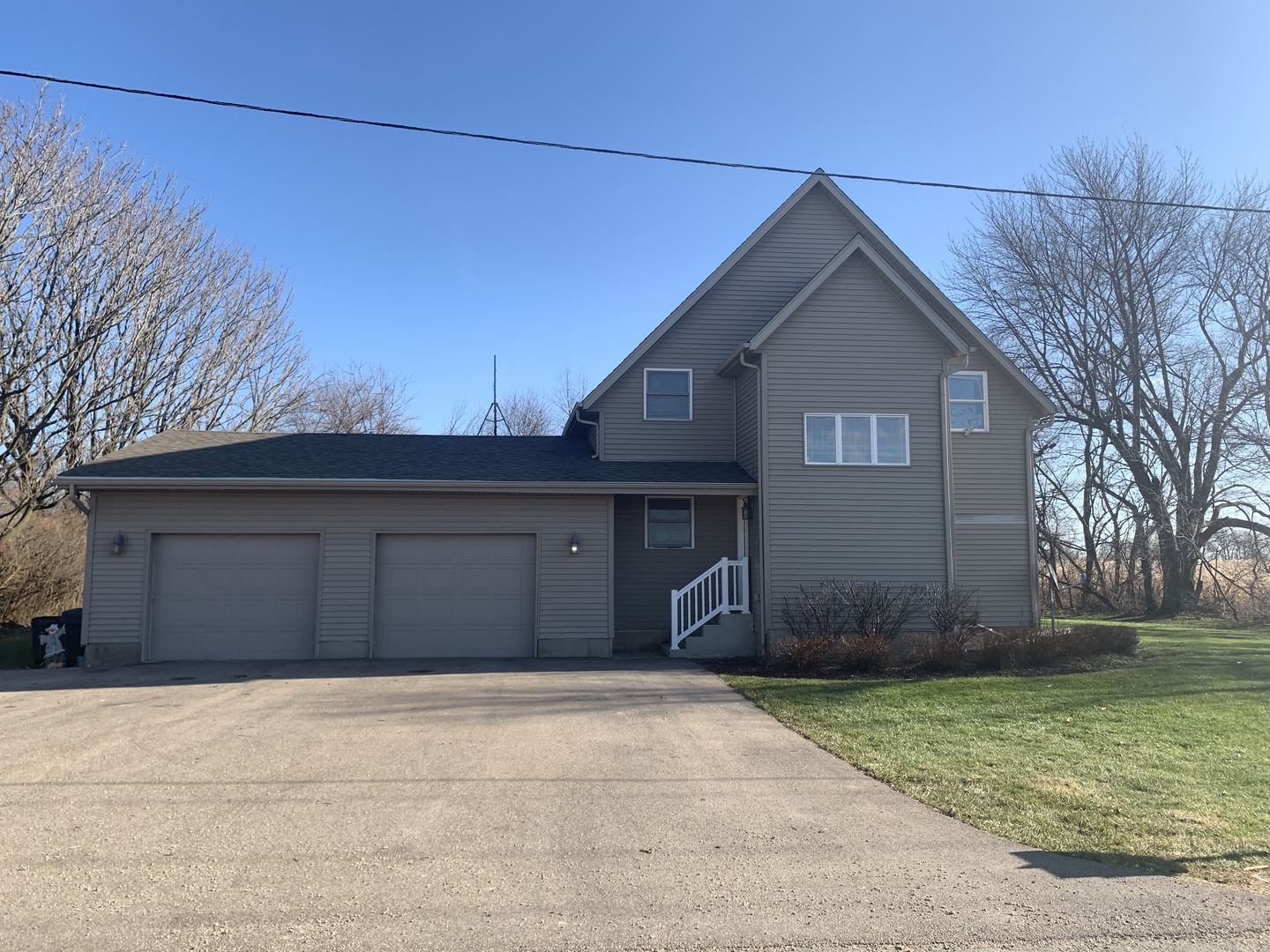 11791 North Leaf River Road Leaf River, IL 61047 - Photo 1 of 3 a front view of a house with garden