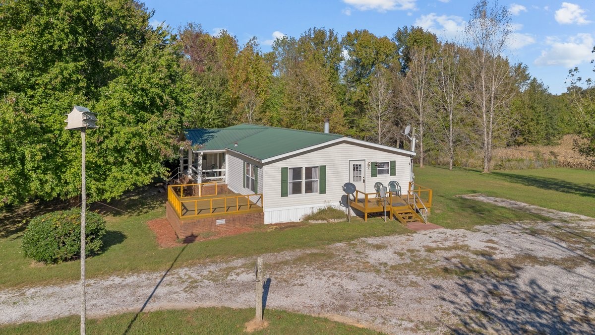 2164 Cedar Grove Road Big Sandy, TN 38221 - Photo 3 of 51 a view of a house with backyard