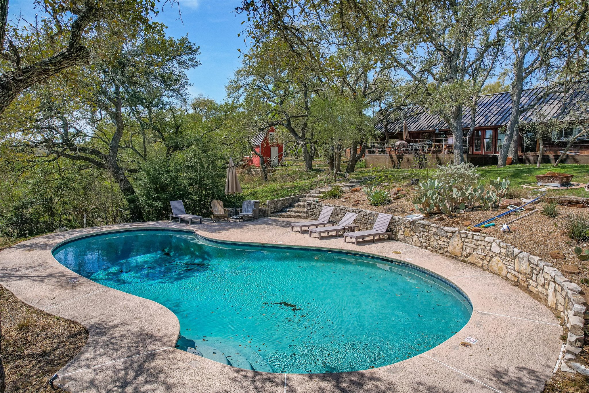 411 Whitetail Ridge Austin, TX 78737 - Photo 32 of 38 Outdoor pool with a patio area