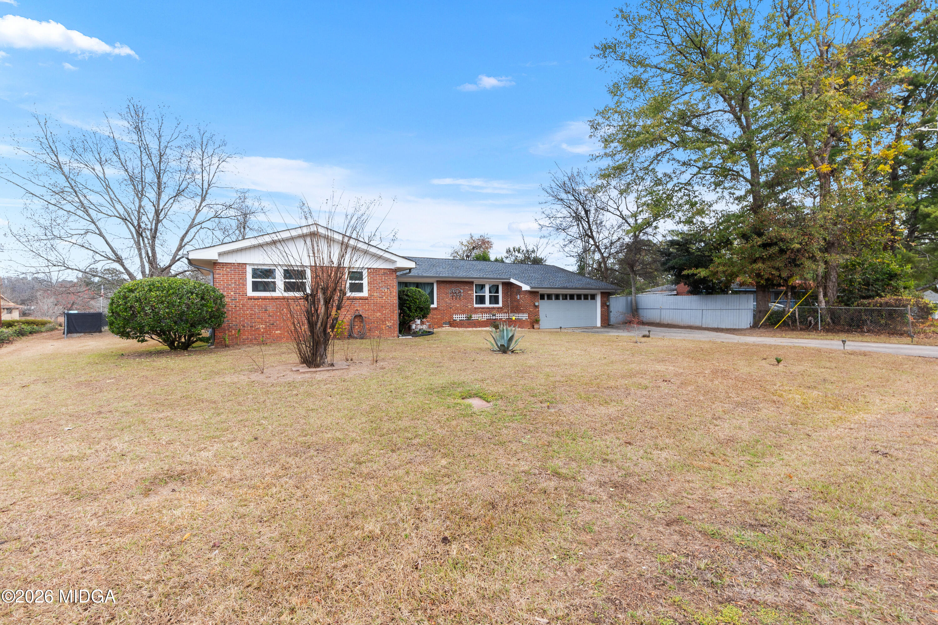 121 Crestwood Road Warner Robins, GA 31093 - Photo 40 of 50 a view of a house with a snow in the yard