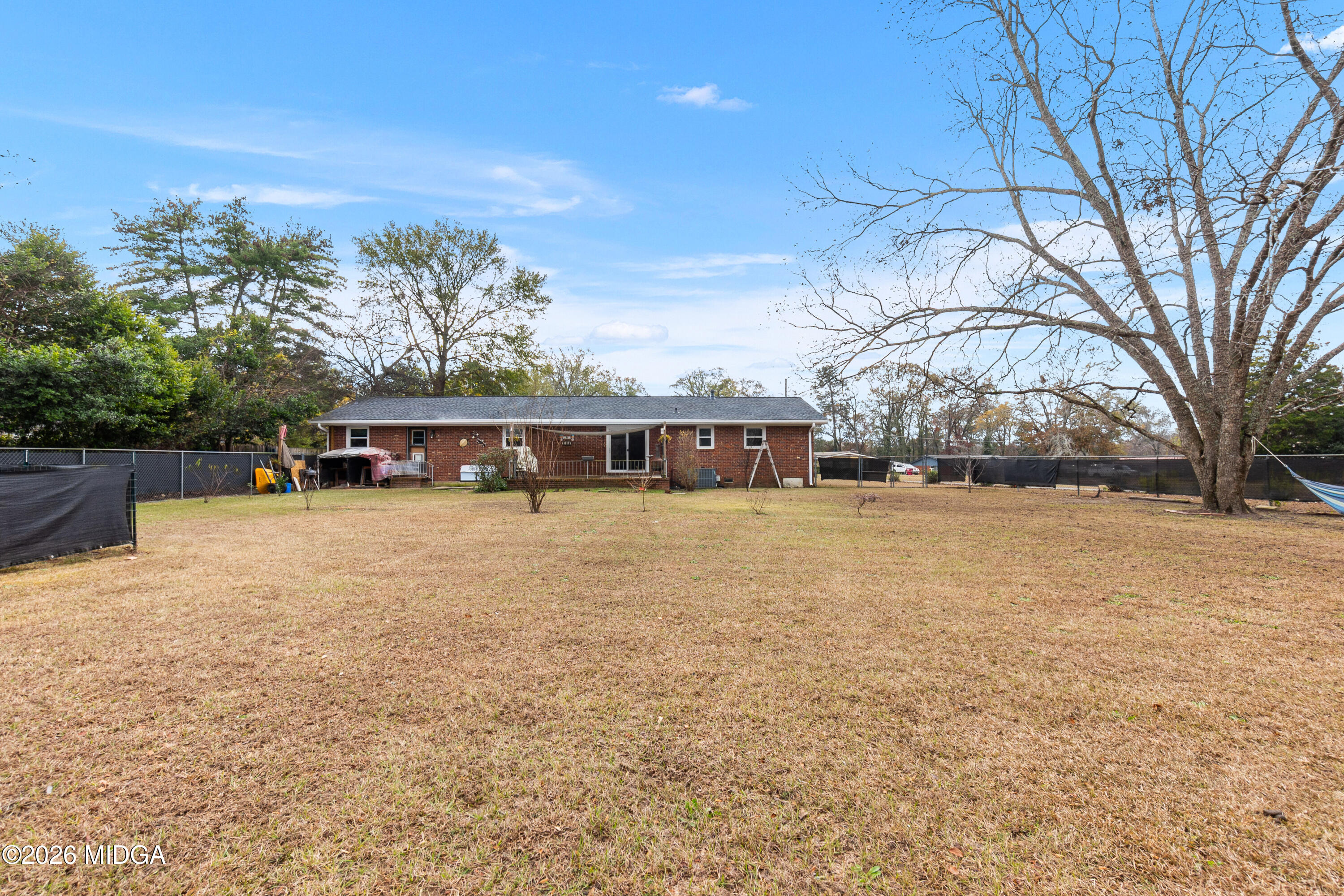 121 Crestwood Road Warner Robins, GA 31093 - Photo 43 of 50 a front view of house with yard and trees in the background