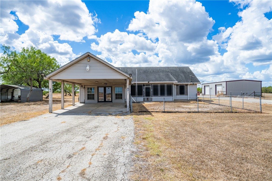 1777 County Road 170 Alice, TX 78332 - Photo 3 of 40 a front view of a house with a garden