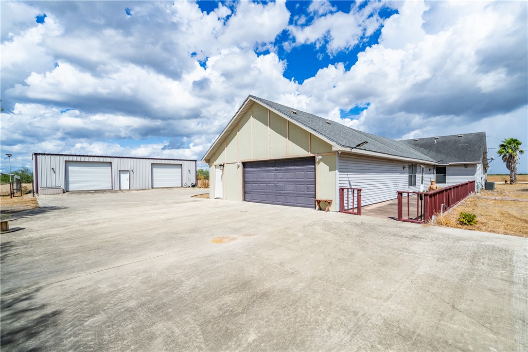 1777 County Road 170 Alice, TX 78332 - Photo 32 of 40 a big house with large windows and a big yard