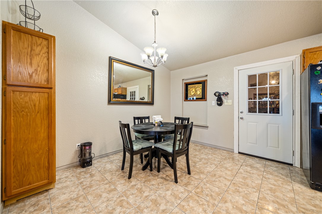 1777 County Road 170 Alice, TX 78332 - Photo 9 of 40 a view of a dining room with furniture and a chandelier