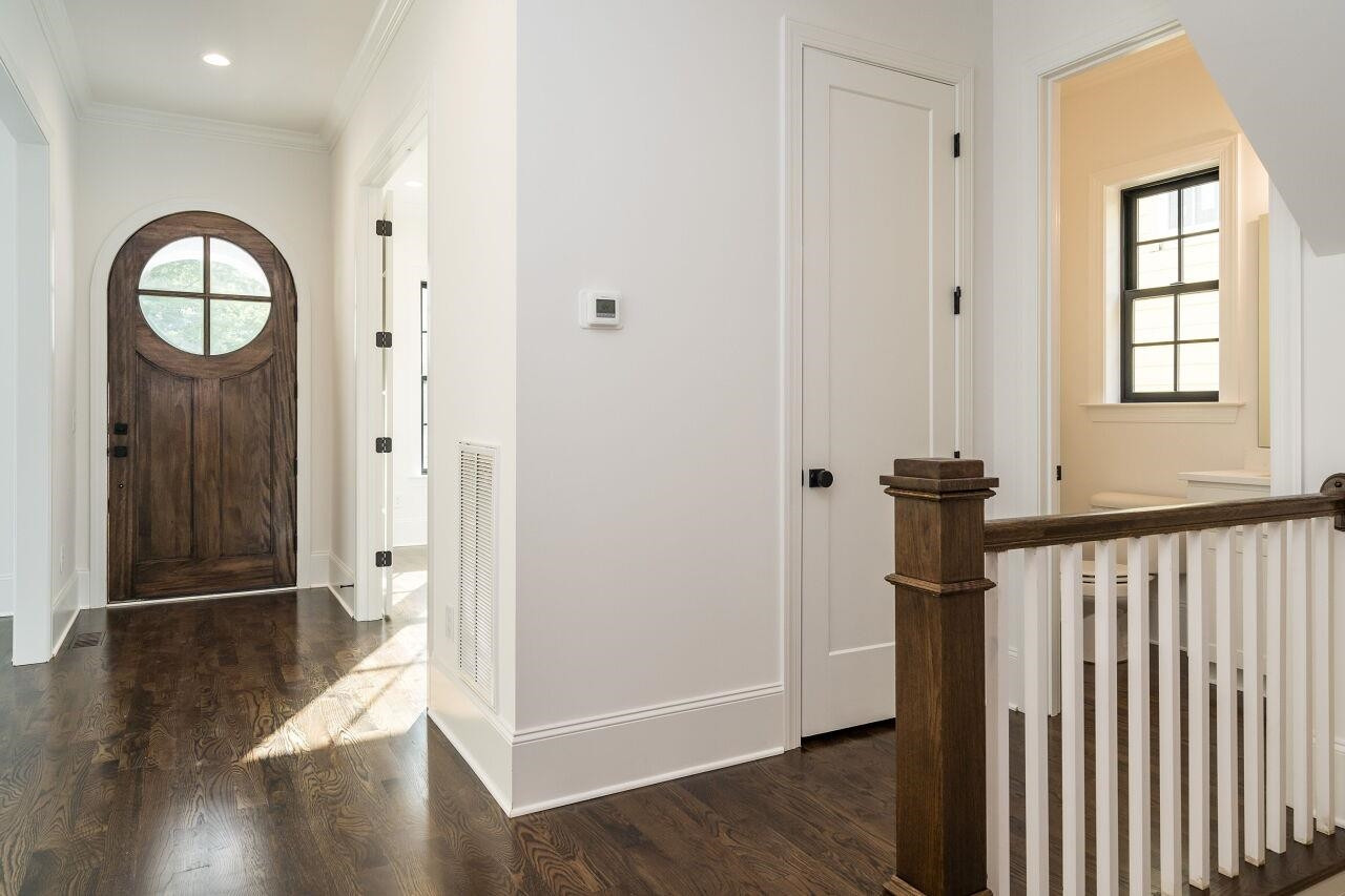 303 Shepherd Street Raleigh, NC 27607 - Photo 12 of 29 a view of a hallway with wooden floor