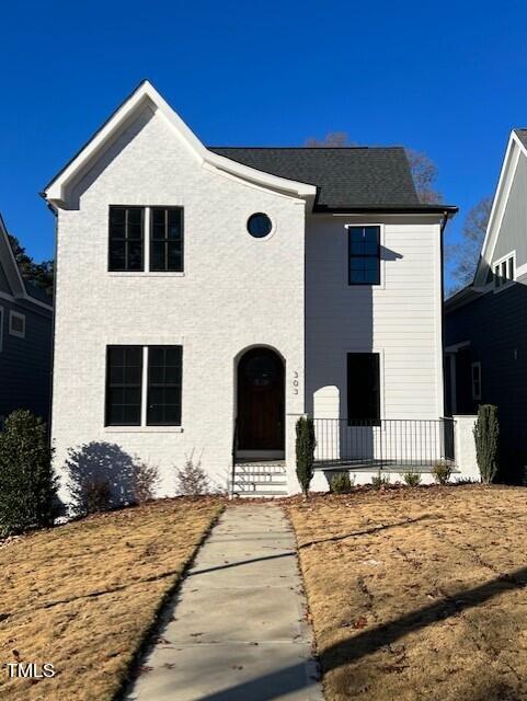 303 Shepherd Street Raleigh, NC 27607 - Photo 18 of 29 a front view of a house with a yard