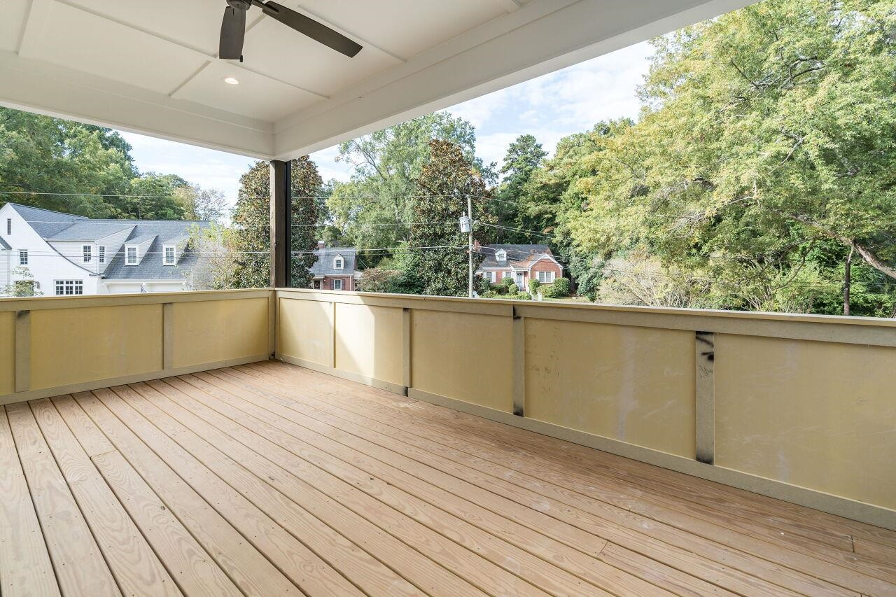 303 Shepherd Street Raleigh, NC 27607 - Photo 3 of 29 a view of a room with wooden floor and outdoor space