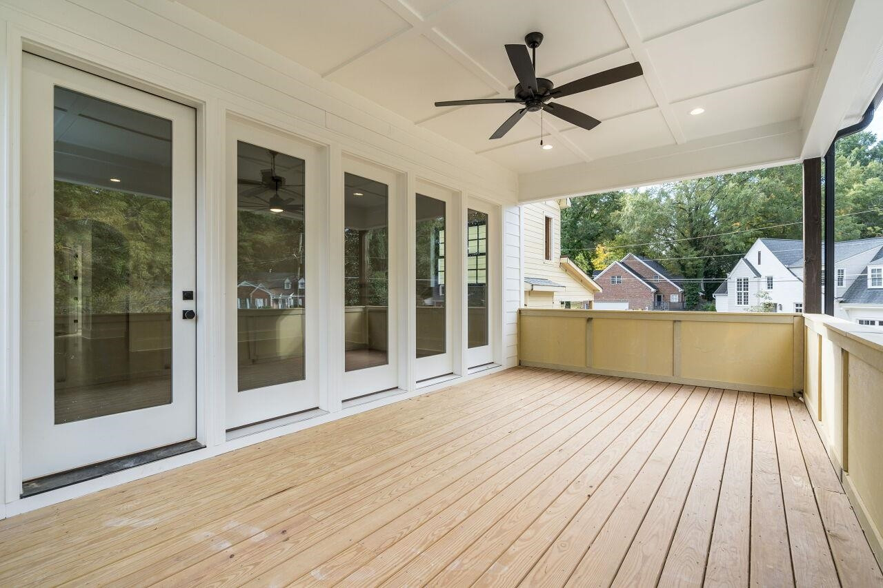 303 Shepherd Street Raleigh, NC 27607 - Photo 4 of 29 a view of a livingroom with wooden floor and a ceiling fan