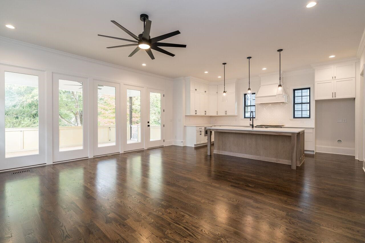 303 Shepherd Street Raleigh, NC 27607 - Photo 8 of 29 a view of an empty room with kitchen and window