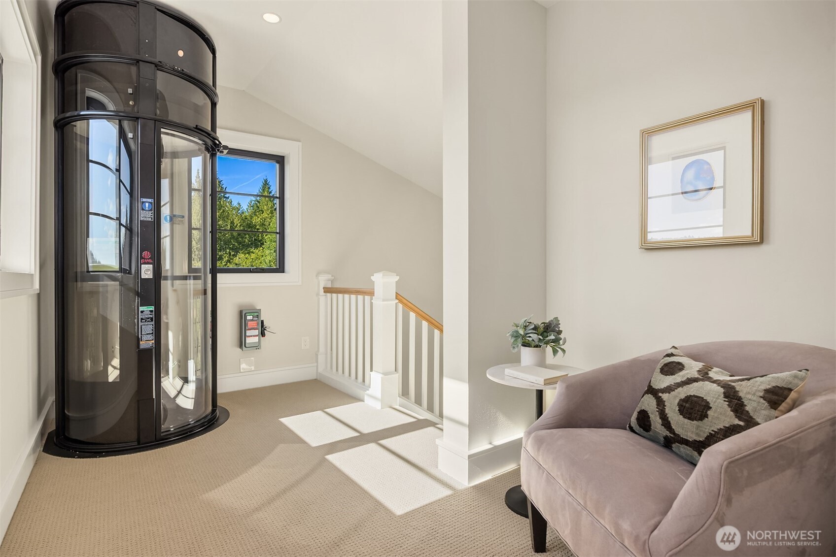 4869 Rosalind Road Northeast Bainbridge Island, WA 98110 - Photo 19 of 40 a living room with furniture and a floor to ceiling window