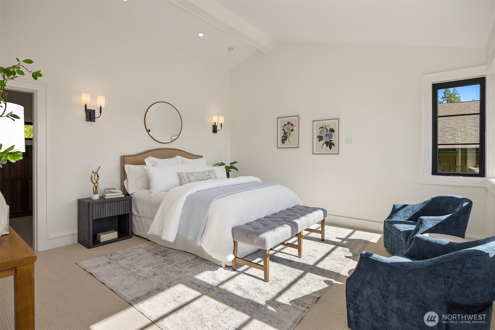 4869 Rosalind Road Northeast Bainbridge Island, WA 98110 - Photo 20 of 40 a bedroom with a bed and glass windows