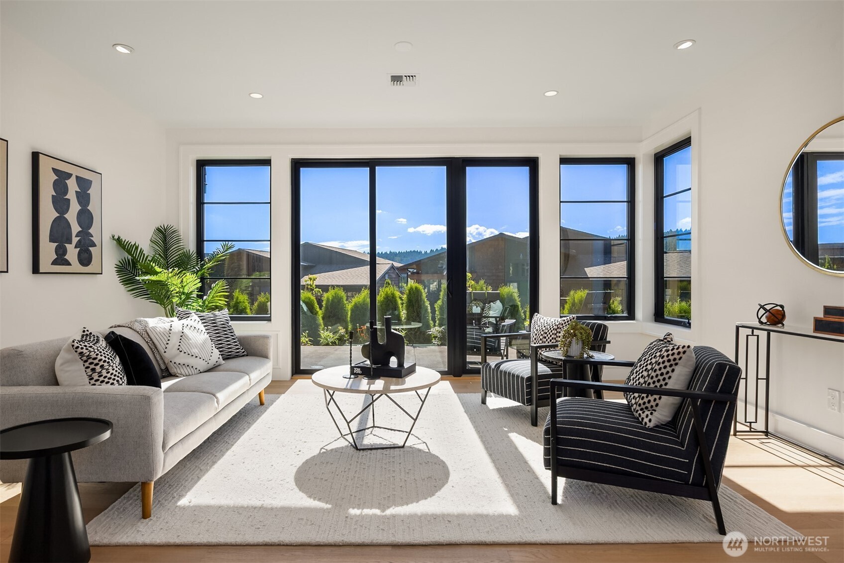 4869 Rosalind Road Northeast Bainbridge Island, WA 98110 - Photo 26 of 40 a living room with furniture and a large window
