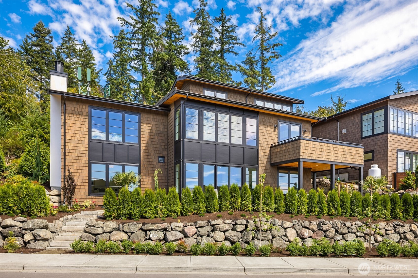 4869 Rosalind Road Northeast Bainbridge Island, WA 98110 - Photo 34 of 40 a front view of white house