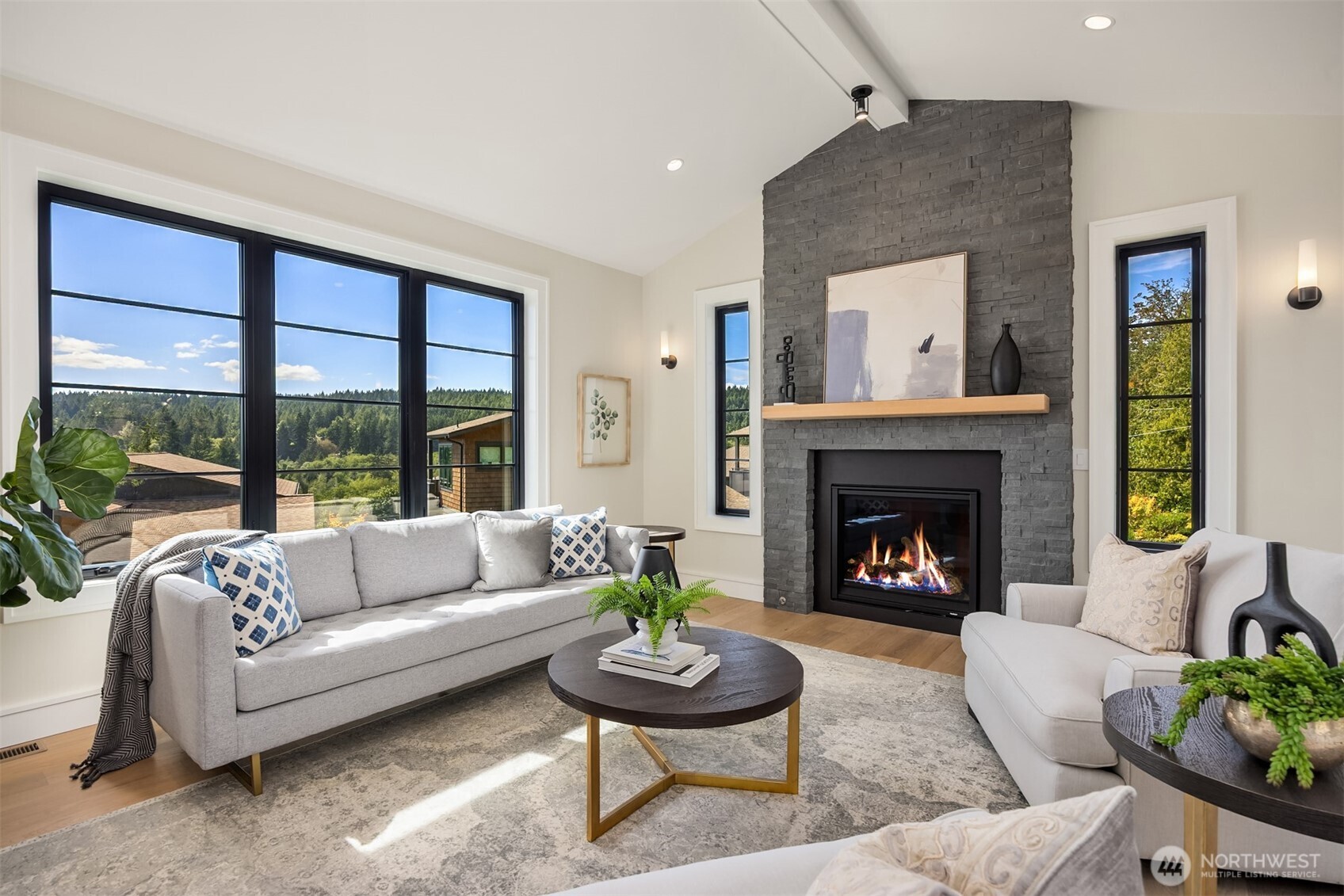 4869 Rosalind Road Northeast Bainbridge Island, WA 98110 - Photo 9 of 40 a living room with furniture and a fireplace