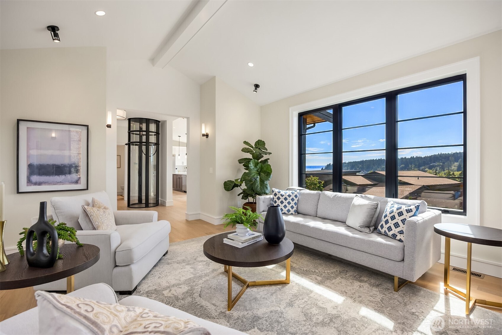 4869 Rosalind Road Northeast Bainbridge Island, WA 98110 - Photo 10 of 40 a living room with furniture and a large window