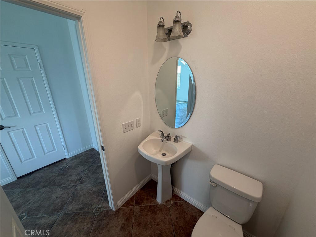 6179 Cedar Creek Road Eastvale, CA 92880 - Photo 13 of 36 1st Floor Half Bathroom