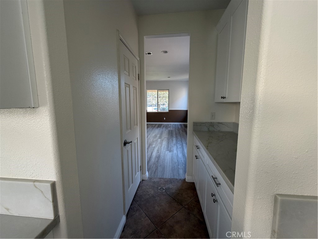 6179 Cedar Creek Road Eastvale, CA 92880 - Photo 14 of 36 1st Floor Kitchen Hallway to Living Room