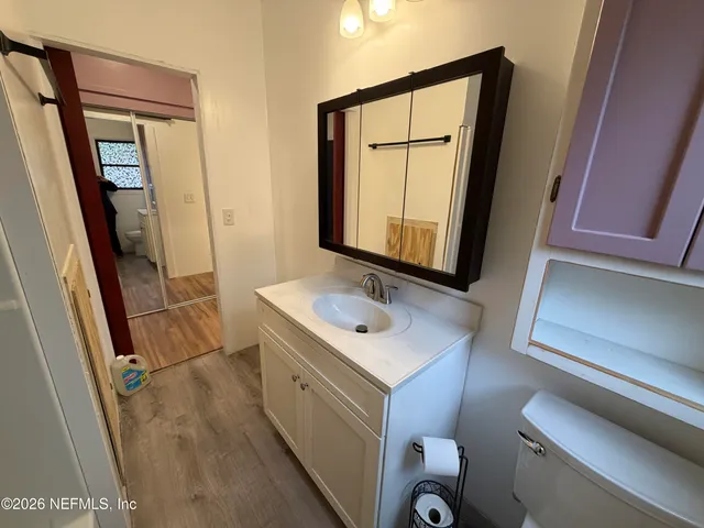a view of a hallway with washer and dryer