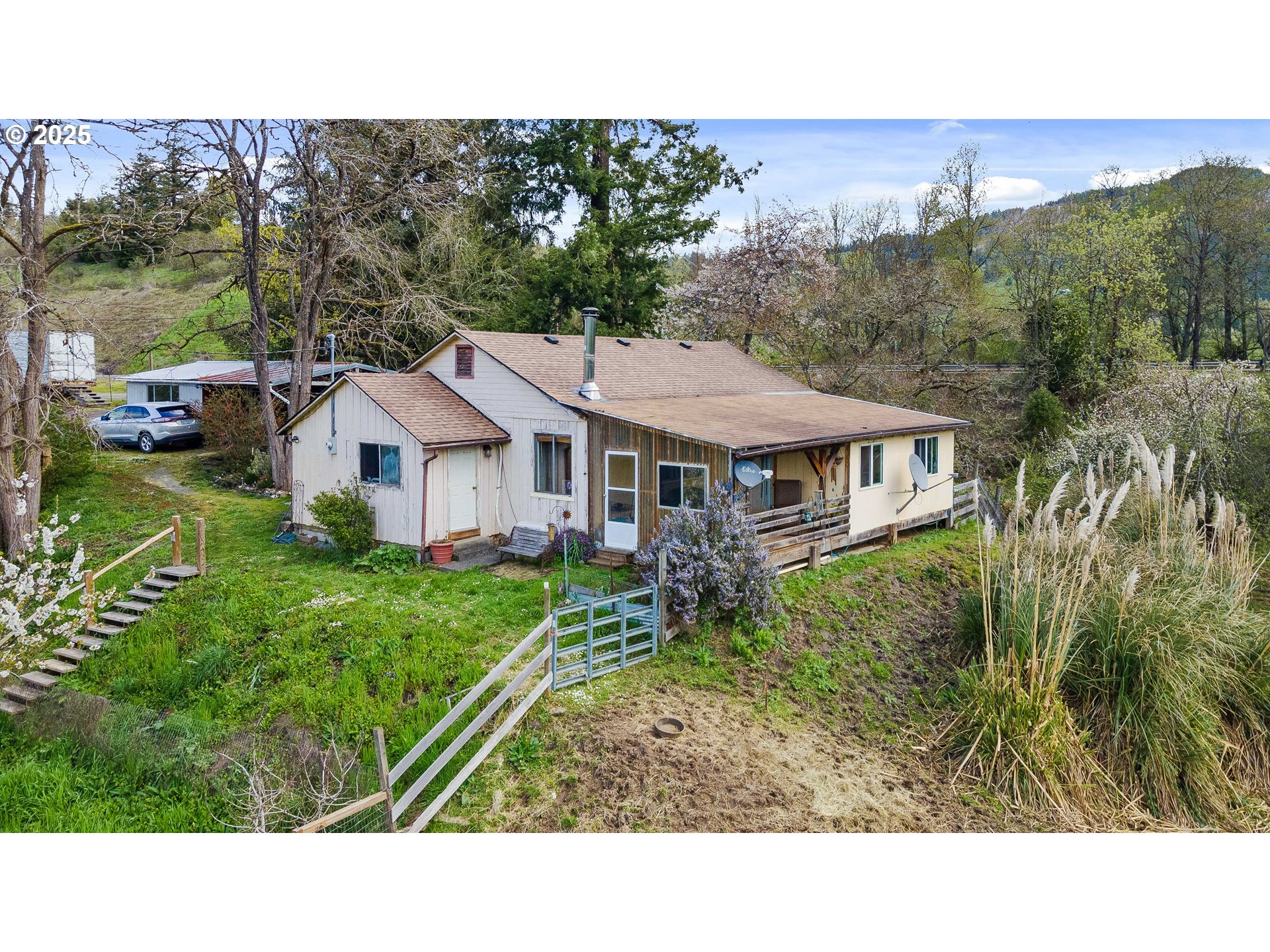 14982 Highway 42 Myrtle Point, OR 97458 - Photo 1 of 48 a aerial view of a house with yard and green space