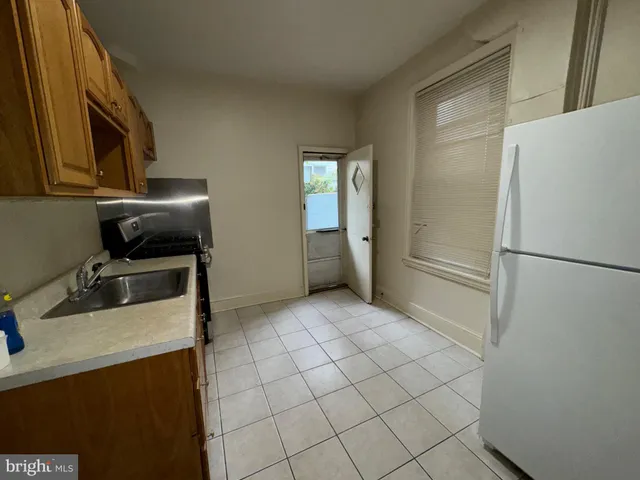 a kitchen with a refrigerator