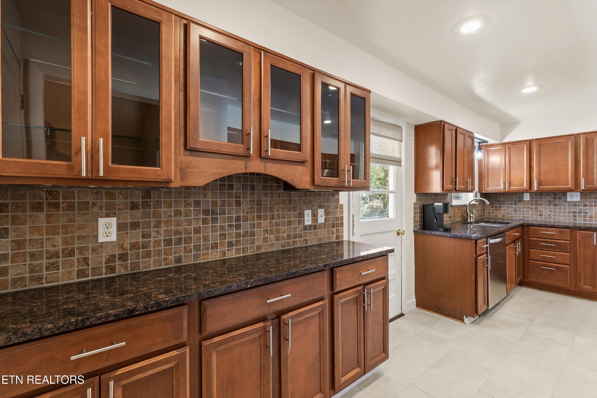 4912 Spring Creek Road Knoxville, TN 37920 - Photo 13 of 29 a kitchen with stainless steel appliances granite countertop a sink stove and cabinets