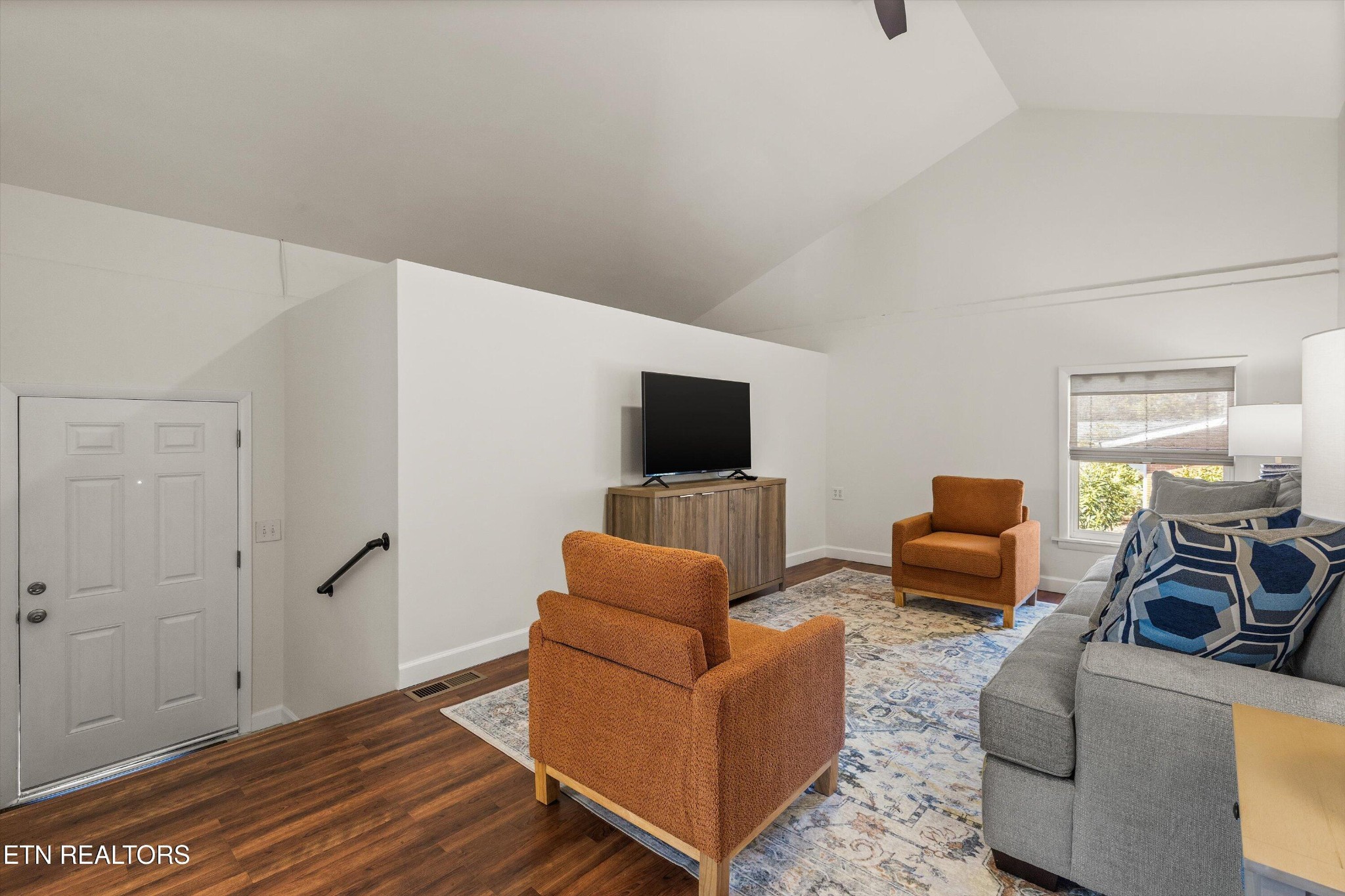 4912 Spring Creek Road Knoxville, TN 37920 - Photo 16 of 29 a living room with furniture and a flat screen tv
