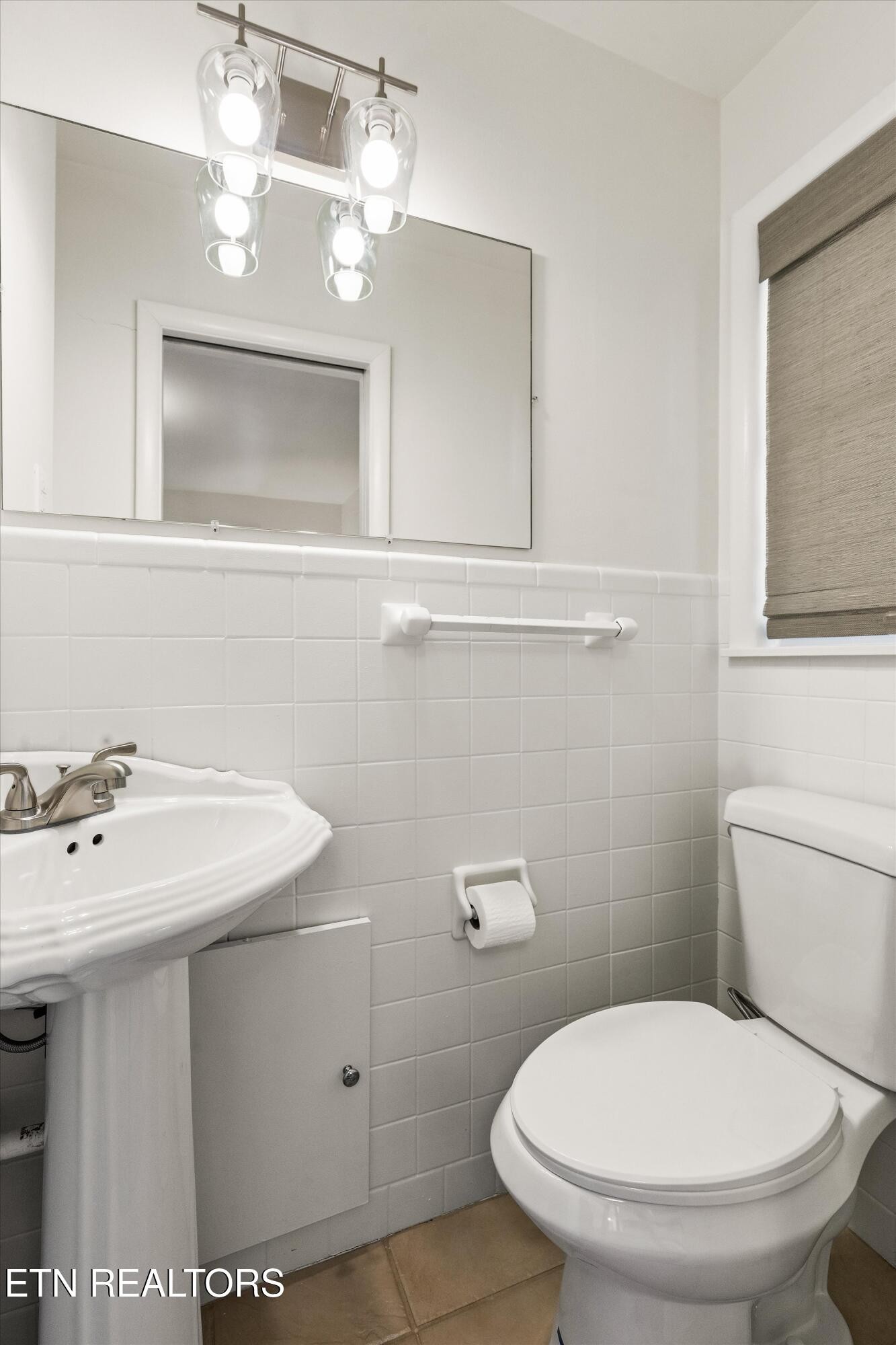 4912 Spring Creek Road Knoxville, TN 37920 - Photo 21 of 29 a bathroom with a toilet sink and mirror