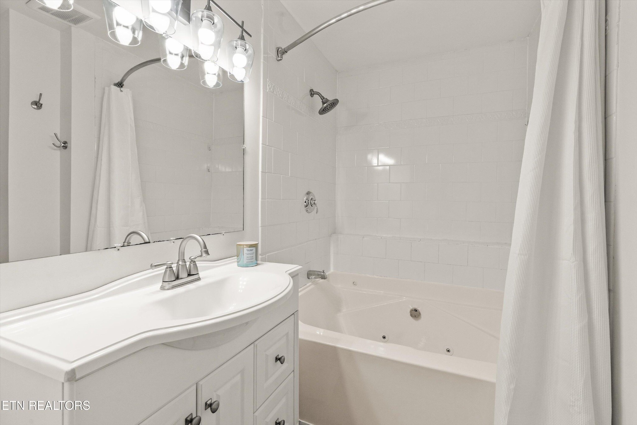 4912 Spring Creek Road Knoxville, TN 37920 - Photo 24 of 29 a bathroom with a sink a toilet and shower