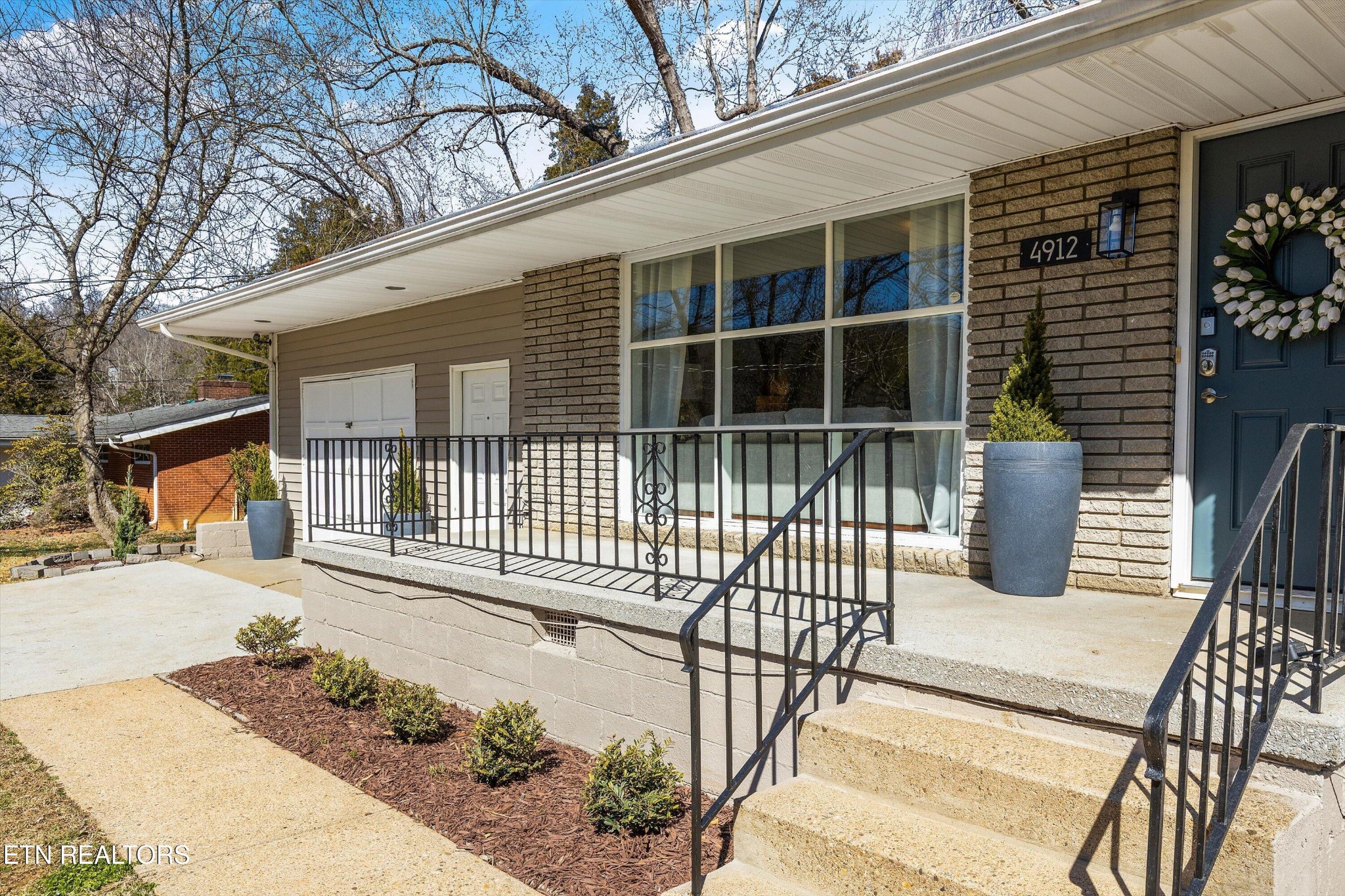 4912 Spring Creek Road Knoxville, TN 37920 - Photo 28 of 29 a view of a house with a wooden fence