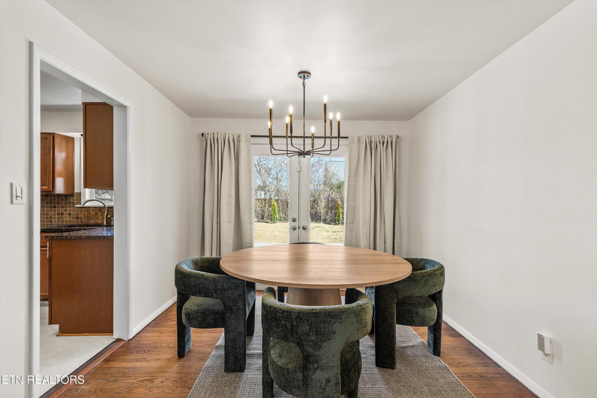 4912 Spring Creek Road Knoxville, TN 37920 - Photo 10 of 29 a view of a dining room with furniture window and wooden floor