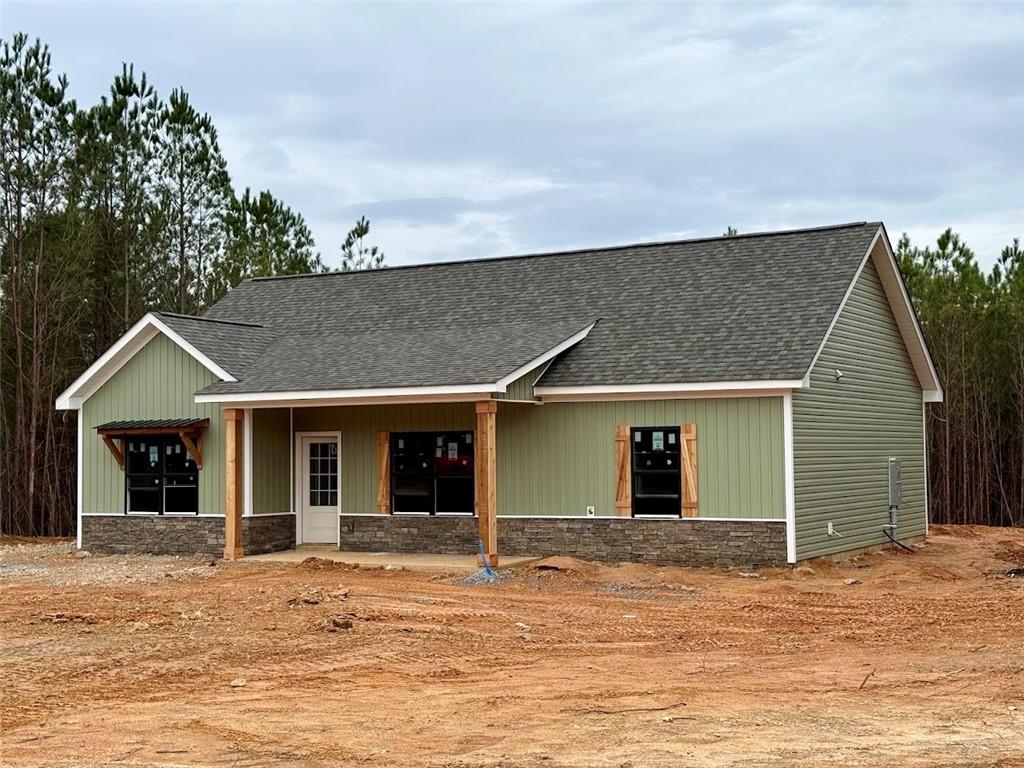 466 Mt Zion Church Road Tallapoosa, GA 30176 - Photo 2 of 42 a front view of a house with a garden
